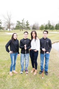 Kristin Smedley and her children standing on a golf course
