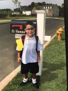 Michael on first day of Kindergarten at the mailbox smiling